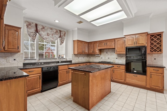4423 Nassau Dr, Sugar Land, TX 77479 - kitchen with crown molding, a sink, a center island, light tile patterned floors, and black appliances