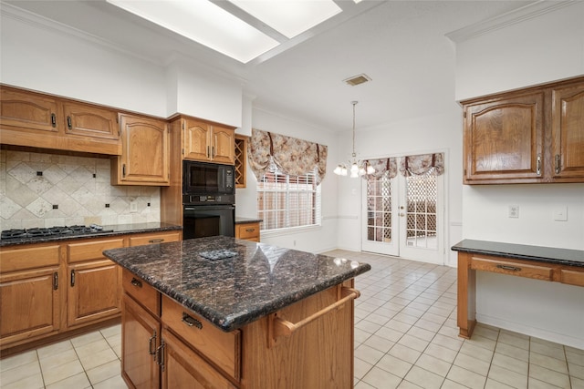 4423 Nassau Dr, Sugar Land, TX 77479 - kitchen featuring visible vents, an inviting chandelier, light tile patterned floors, backsplash, and black appliances