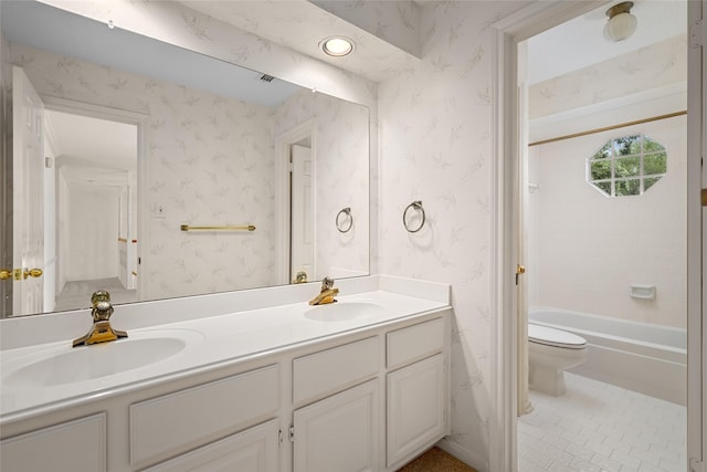 4423 Nassau Dr, Sugar Land, TX 77479 - full bathroom with double vanity, toilet, wallpapered walls, and a sink