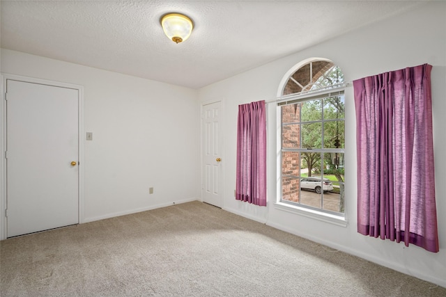 4423 Nassau Dr, Sugar Land, TX 77479 - carpeted spare room with a textured ceiling and baseboards