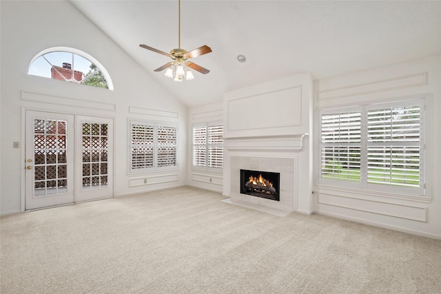 4423 Nassau Dr, Sugar Land, TX 77479 - unfurnished living room with ceiling fan, a tile fireplace, carpet, and high vaulted ceiling