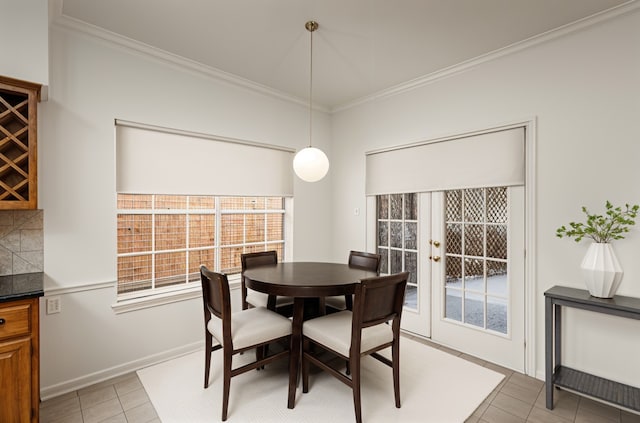 4423 Nassau Dr, Sugar Land, TX 77479 - dining area with crown molding, baseboards, and light tile patterned floors