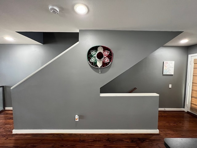 interior space with baseboards, recessed lighting, and wood finished floors
