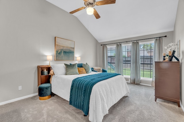 bedroom with baseboards, carpet, a ceiling fan, and lofted ceiling
