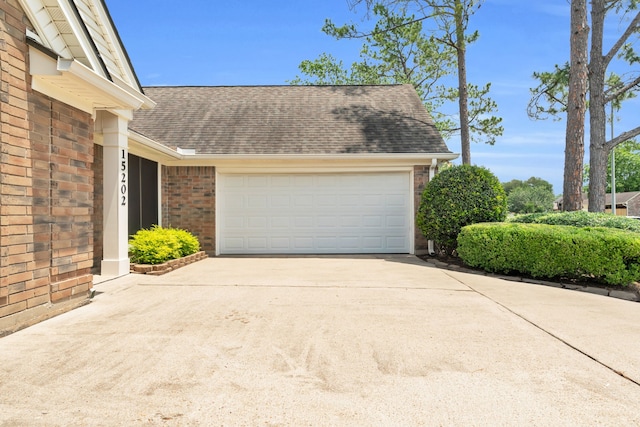 garage featuring driveway