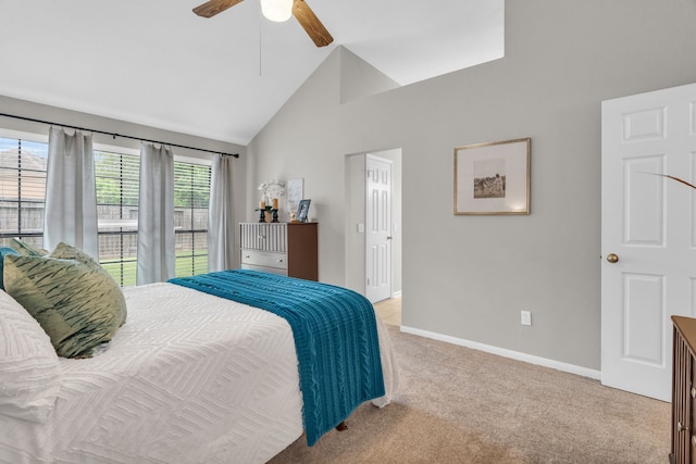 bedroom featuring high vaulted ceiling, baseboards, light carpet, and a ceiling fan