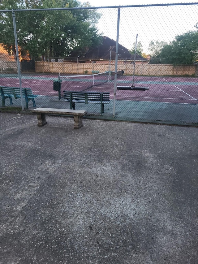 view of sport court with fence