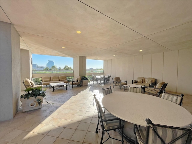 dining space featuring light tile patterned floors