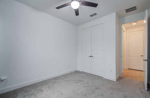 8815 Drysdale River Rd, Cypress, TX 77433 - unfurnished bedroom featuring baseboards, visible vents, carpet, and a closet