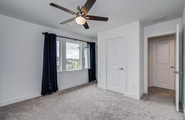 8815 Drysdale River Rd, Cypress, TX 77433 - unfurnished bedroom featuring carpet floors, baseboards, visible vents, and ceiling fan