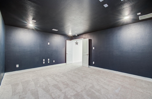 8815 Drysdale River Rd, Cypress, TX 77433 - carpeted empty room with a textured ceiling, baseboards, and visible vents