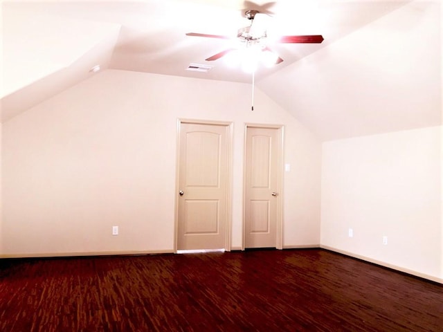 bonus room with a ceiling fan, visible vents, wood finished floors, baseboards, and lofted ceiling