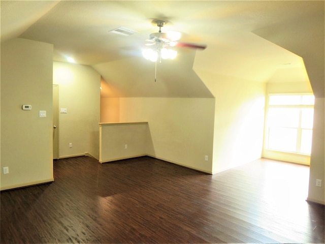 bonus room with visible vents, wood finished floors, lofted ceiling, baseboards, and ceiling fan
