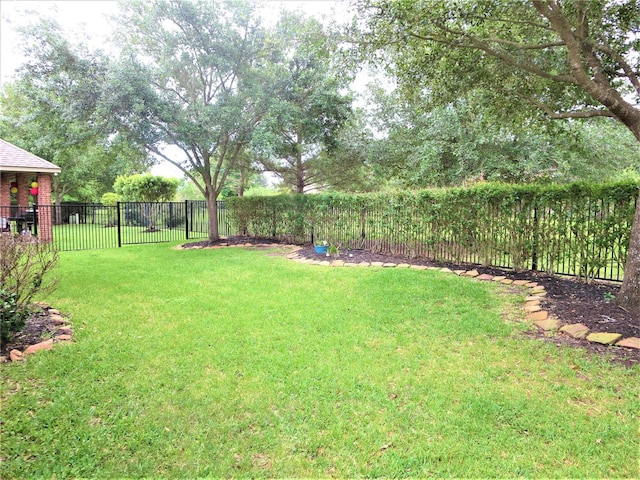 view of yard with a fenced backyard