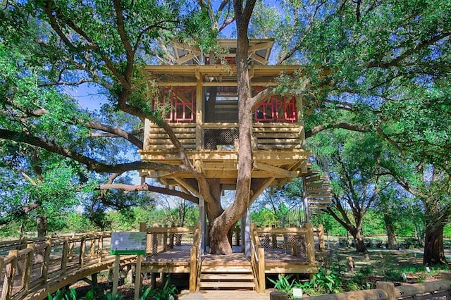 back of property featuring a wooden deck