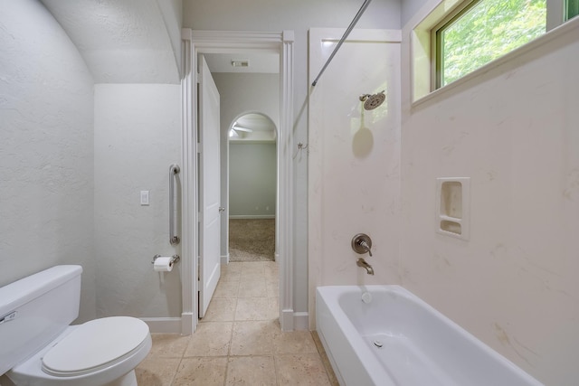 full bath featuring toilet, baseboards, visible vents, and shower / tub combination