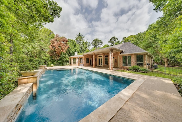 view of swimming pool featuring a fenced in pool, fence, and a patio