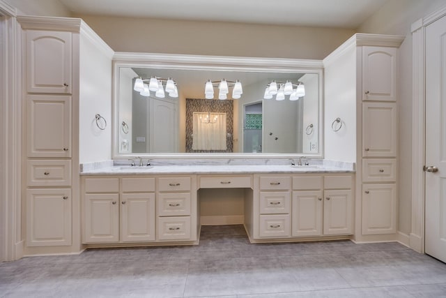 full bathroom featuring double vanity, tile patterned floors, and a sink