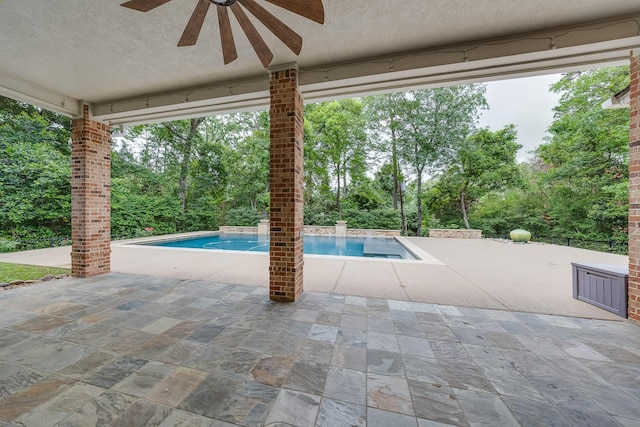 pool featuring ceiling fan and a patio area