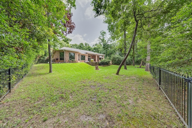view of yard featuring a fenced backyard