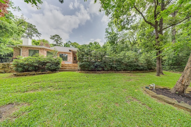 view of yard featuring fence
