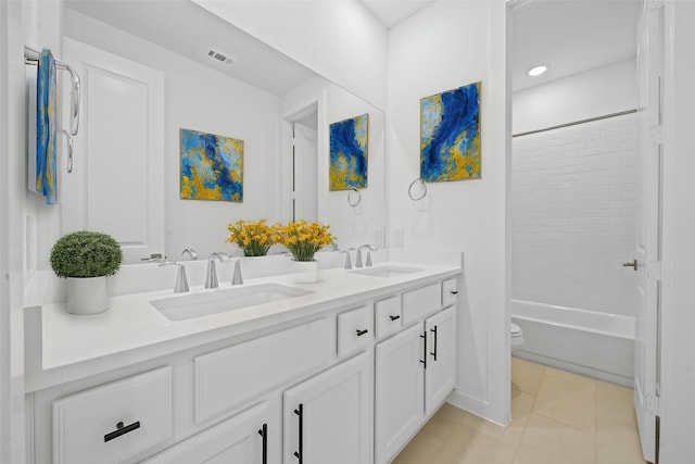 full bath featuring double vanity, toilet, visible vents, and a sink