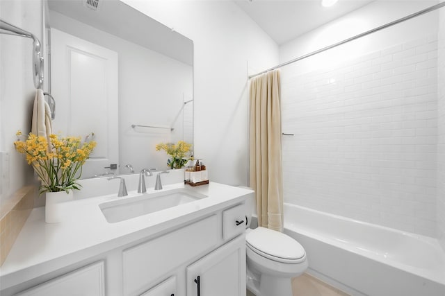 bathroom featuring vanity, shower / bath combo, toilet, and visible vents