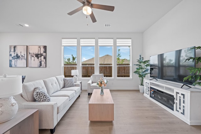 living area featuring recessed lighting, ceiling fan, visible vents, and wood finished floors