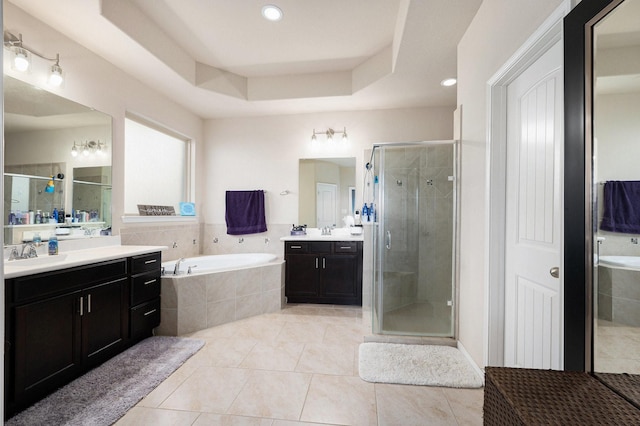 23414 Bracino Lake Dr, Katy, TX 77493 - full bathroom featuring a garden tub, tile patterned flooring, a stall shower, two vanities, and a sink