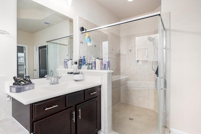 23414 Bracino Lake Dr, Katy, TX 77493 - full bathroom featuring vanity, a stall shower, and visible vents