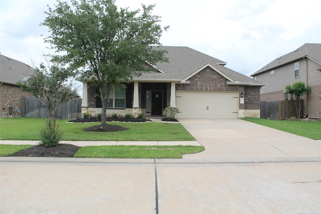 23414 Bracino Lake Dr, Katy, TX 77493 - craftsman inspired home featuring fence, an attached garage, a front yard, and stone siding