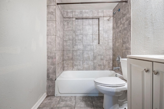 full bath featuring vanity, a textured wall, toilet, shower / bathing tub combination, and tile patterned floors