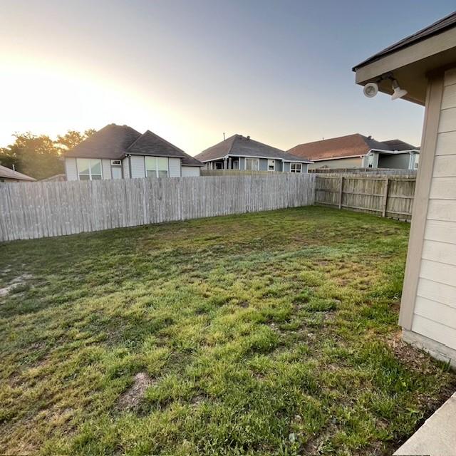 view of yard featuring a fenced backyard
