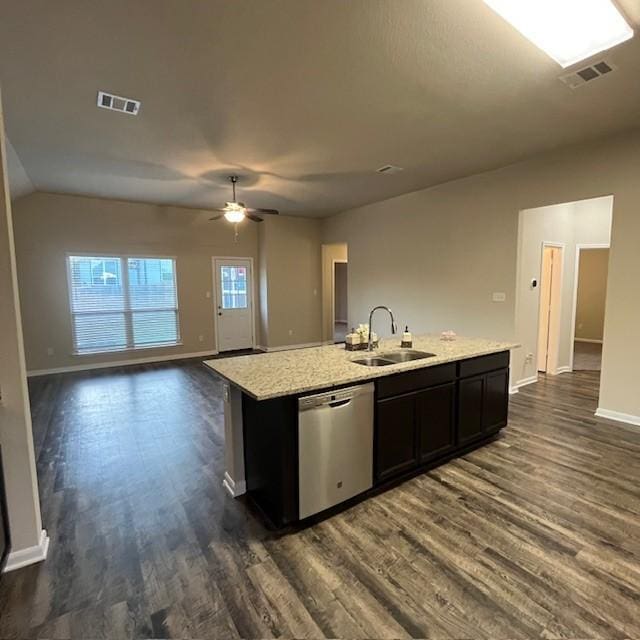 kitchen featuring a sink, dishwasher, an island with sink, dark wood-type flooring, and visible vents
