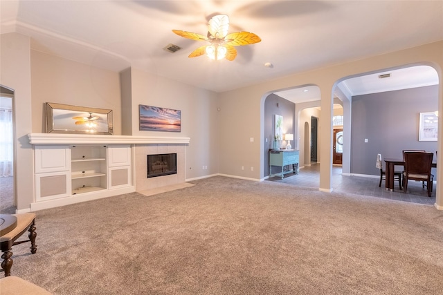 834 Arbor Pne, Tomball, TX 77375 - unfurnished living room featuring a ceiling fan, arched walkways, and carpet floors