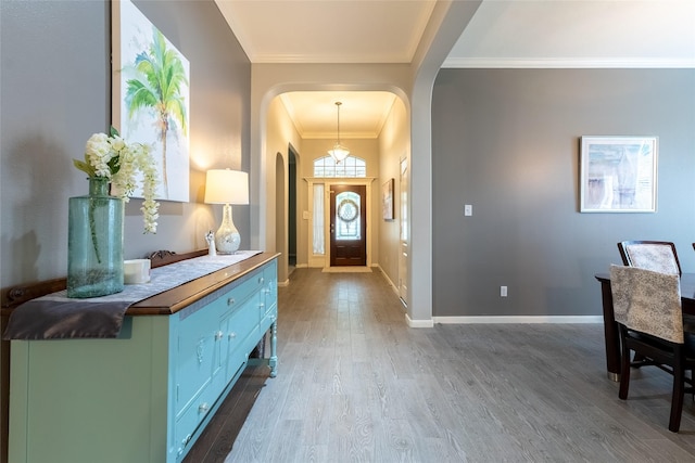834 Arbor Pne, Tomball, TX 77375 - foyer with arched walkways, dark wood finished floors, ornamental molding, and baseboards