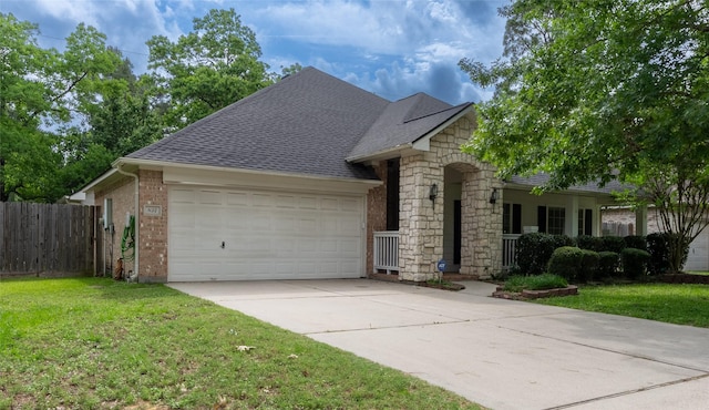 834 Arbor Pne, Tomball, TX 77375 - view of front of property with an attached garage, driveway, a shingled roof, and stone siding
