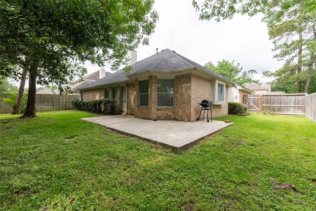 834 Arbor Pne, Tomball, TX 77375 - rear view of house featuring a patio area, brick siding, a chimney, and a gate