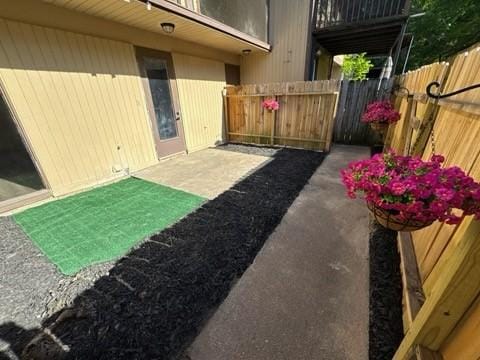 view of yard featuring a patio and fence