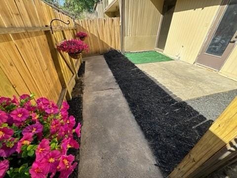 view of yard with fence and a patio area
