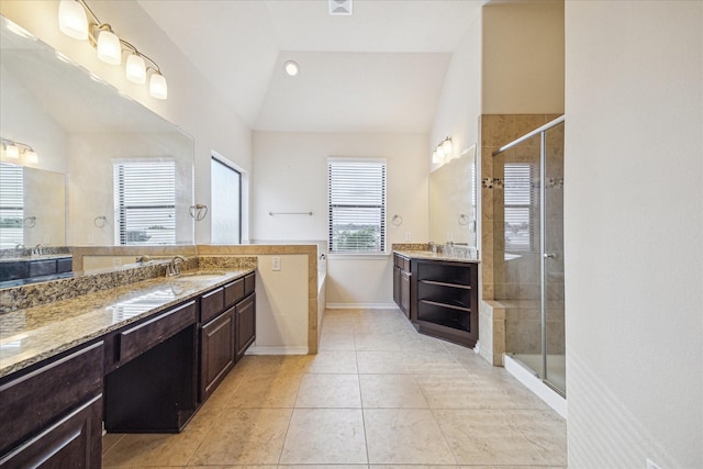 2707 Kings Retreat Cir, Kingwood, TX 77345 - bathroom with a sink, tile patterned floors, vaulted ceiling, and a shower stall