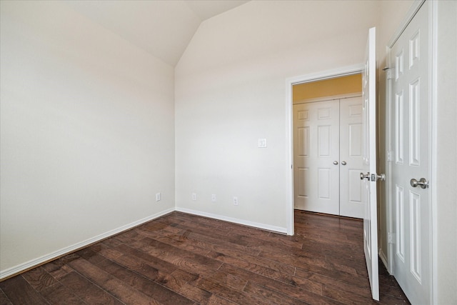 2707 Kings Retreat Cir, Kingwood, TX 77345 - unfurnished room with baseboards, dark wood finished floors, and lofted ceiling