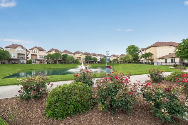 2707 Kings Retreat Cir, Kingwood, TX 77345 - surrounding community featuring a yard, a water view, fence, and a residential view