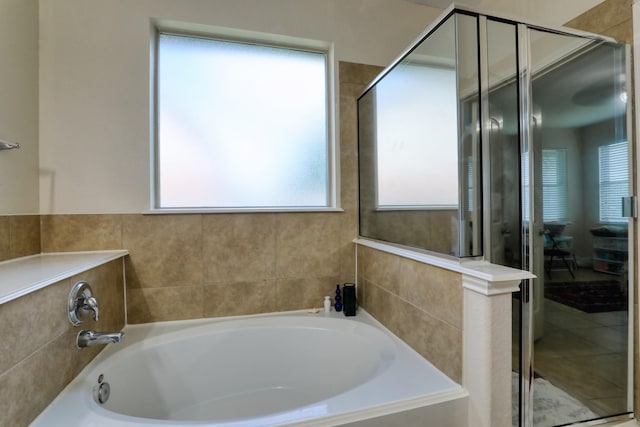 full bath featuring a stall shower and a bath