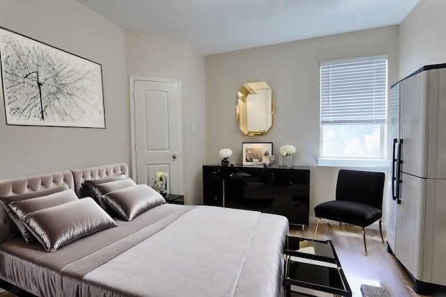 bedroom with wood finished floors