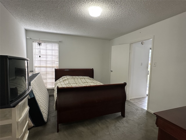 carpeted bedroom with a textured ceiling