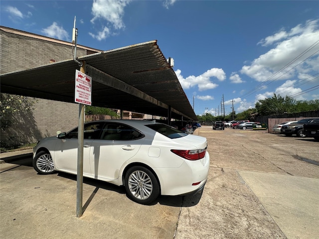 view of partially covered parking lot