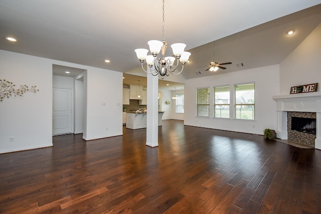 6607 Nicholas Trl, Sugar Land, TX 77479 - unfurnished living room featuring dark wood-style floors, ceiling fan, a fireplace, a chandelier, and lofted ceiling