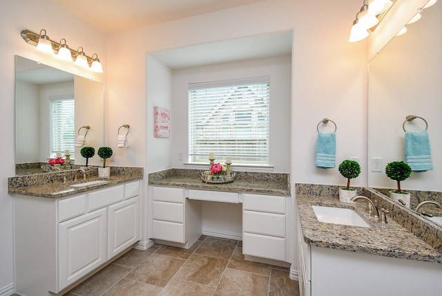 bathroom with two vanities and a sink