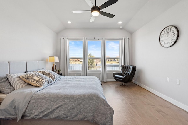 bedroom with baseboards, recessed lighting, a ceiling fan, light wood-style flooring, and vaulted ceiling